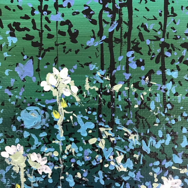 Closeup detail of blue and white foreground flowers 