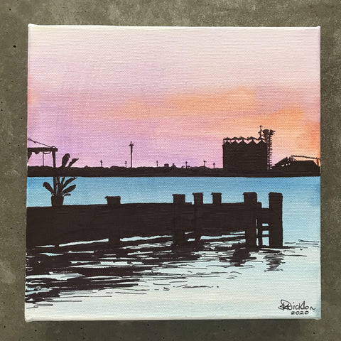 Newcastle harbour foreshore at sunset from the jetty with coal towers in background