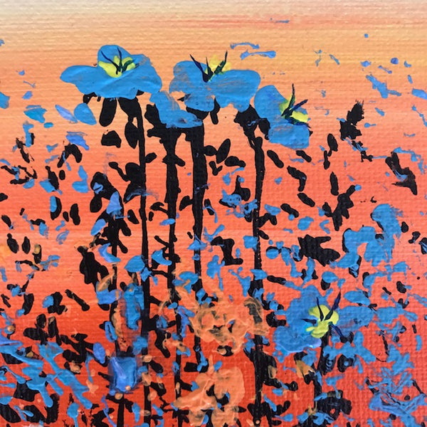 Closeup detail of blue flowers with yellow centres