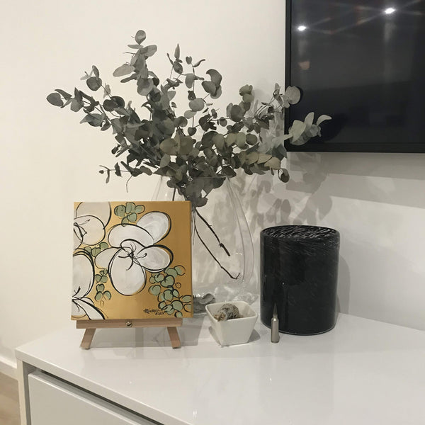 White lilies artwork decorating a home setting